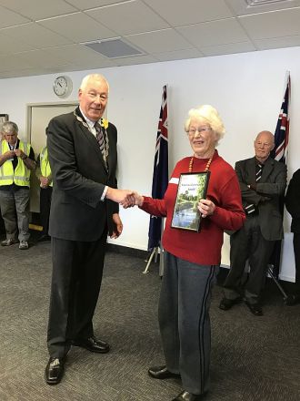 COMMUNITY THANKS: Kawerau Mayor Malcolm Campbell presents Jocelyn Coburn with the community impact award celebrating decades of voluntary work with the community. Photo supplied.