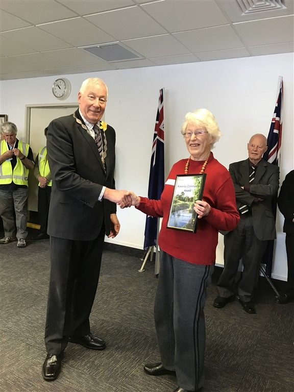 Kawerau Mayor Malcolm Campbell presents Jocelyn Coburn with the Community Impact Award.