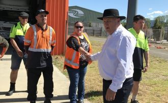 Minister Shane Jones congratulates students at the Toi-EDA Driver Operator Training Centre in Kawerau. 